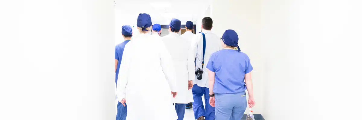 Back View of Doctors Walking Down Hall