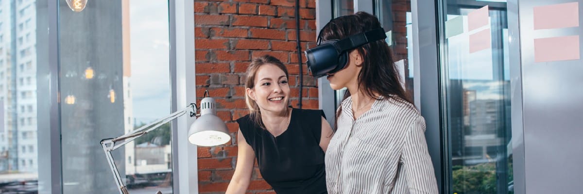 Business Woman Wearing VR for Training While being Coached