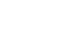 A person viewing a wall of monitors displaying charts, graphs, and data analysis.