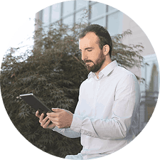 Professional man reviewing information on a digital tablet