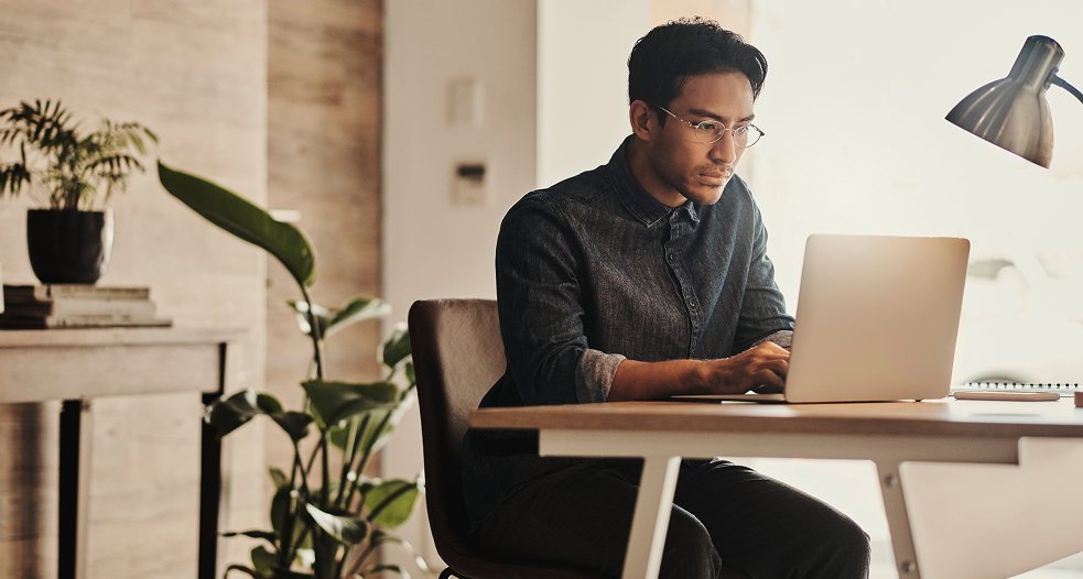 A man focused on his laptop